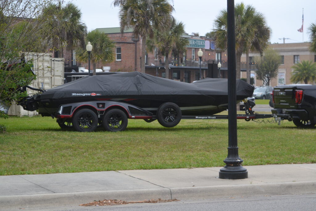 Covered, parked, bass boat